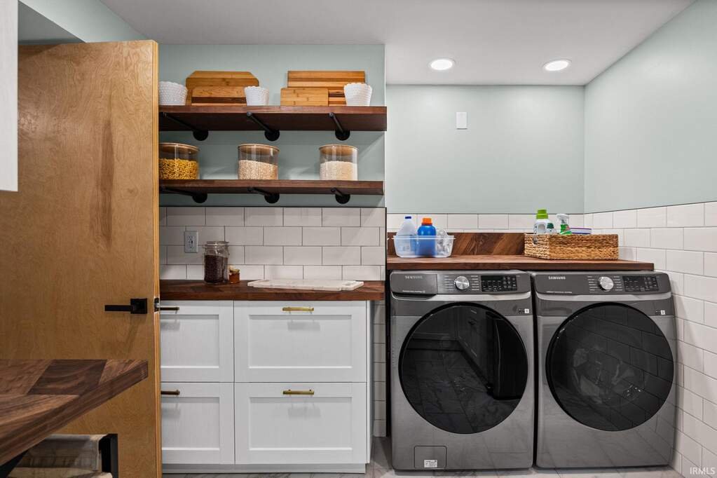 Laundry and craft room with wood counters and open shelving