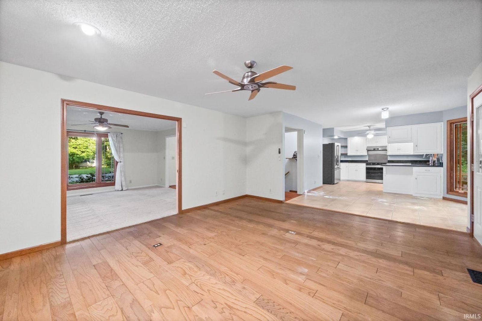 Family room with hardwood floors, fireplace and built-in shelves