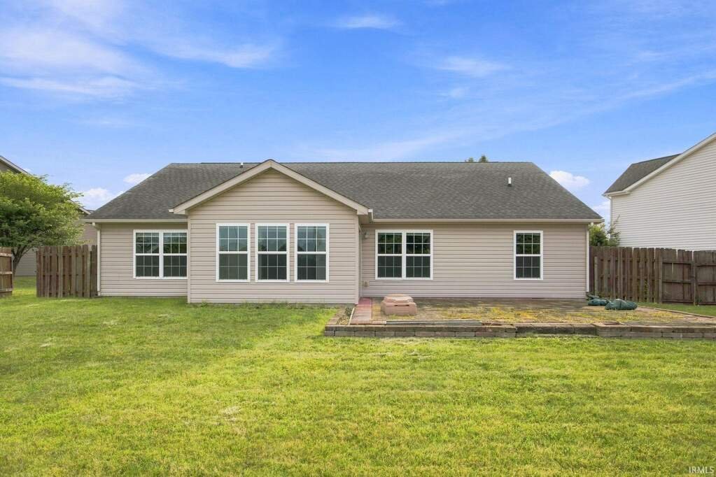 Large fenced backyard behind the home